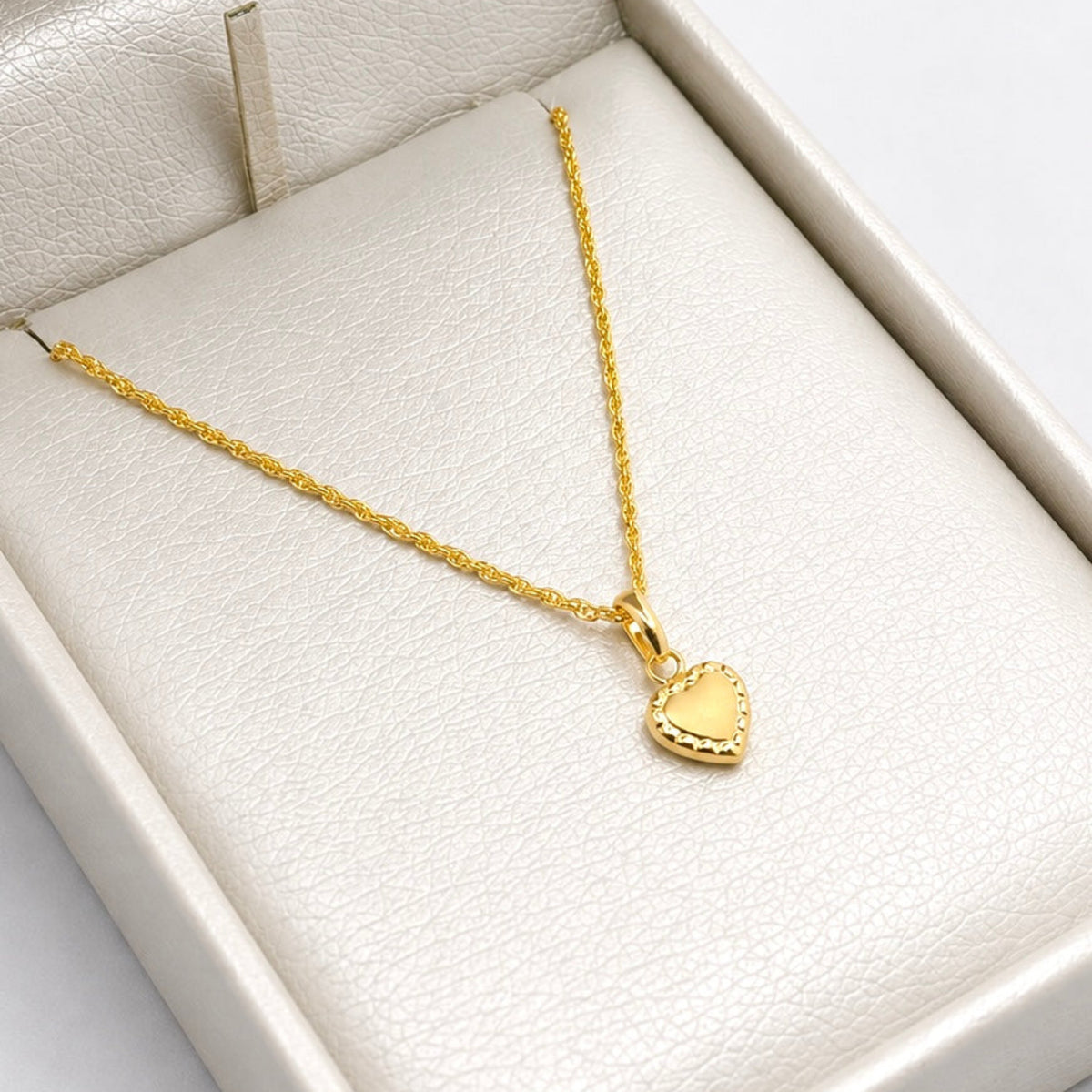 Set Cadena Mini Lazo + Dije Corazón Textura - Oro Amarillo 18K