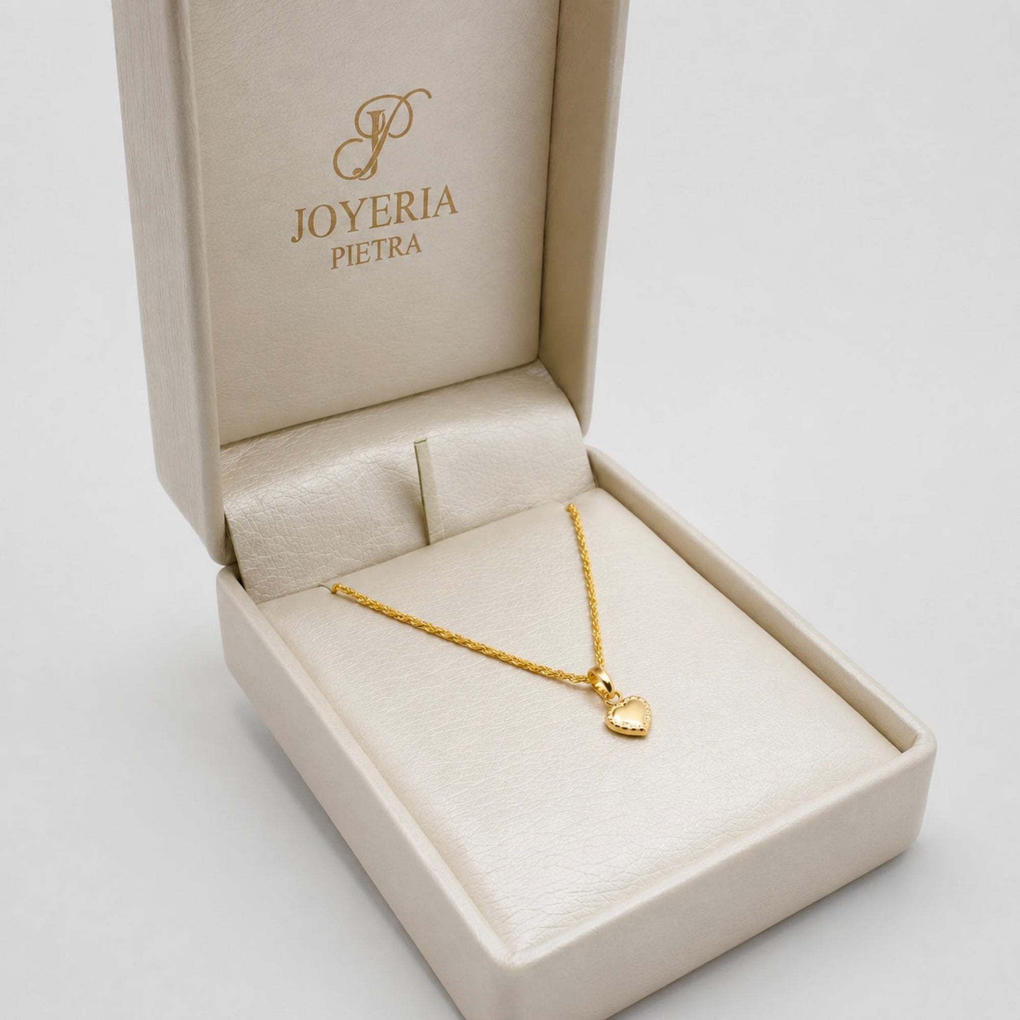 Set Cadena Mini Lazo + Dije Corazón Textura - Oro Amarillo 18K