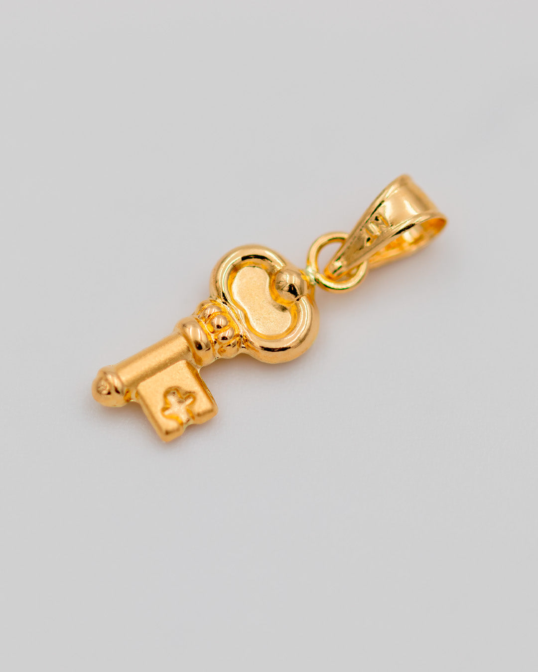 Dije Llave Toquelada, Oro Amarillo 18k - 0,45 gr
