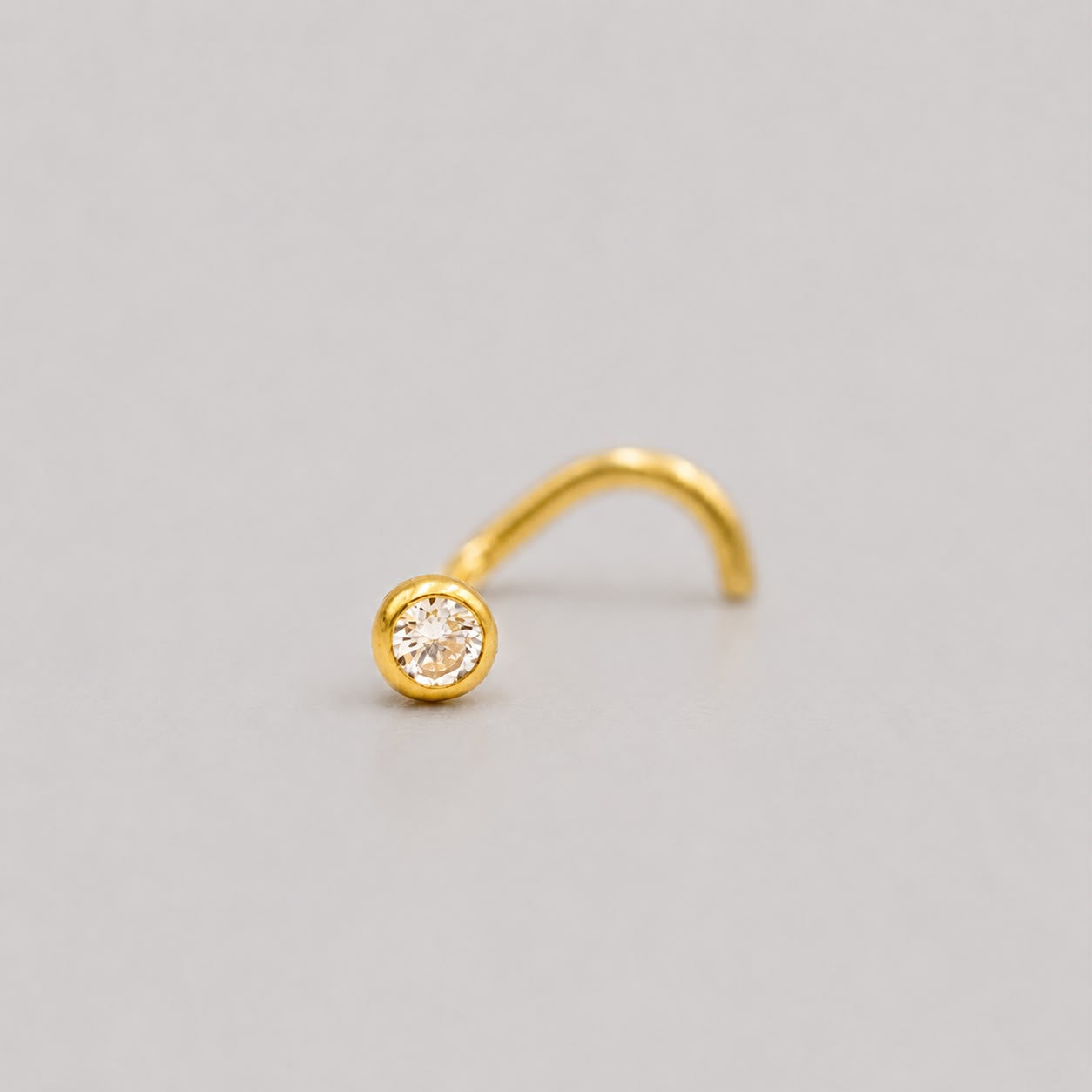 Piercing Nariz Bisel Circón Blanco Curvo - Oro Amarillo 18k